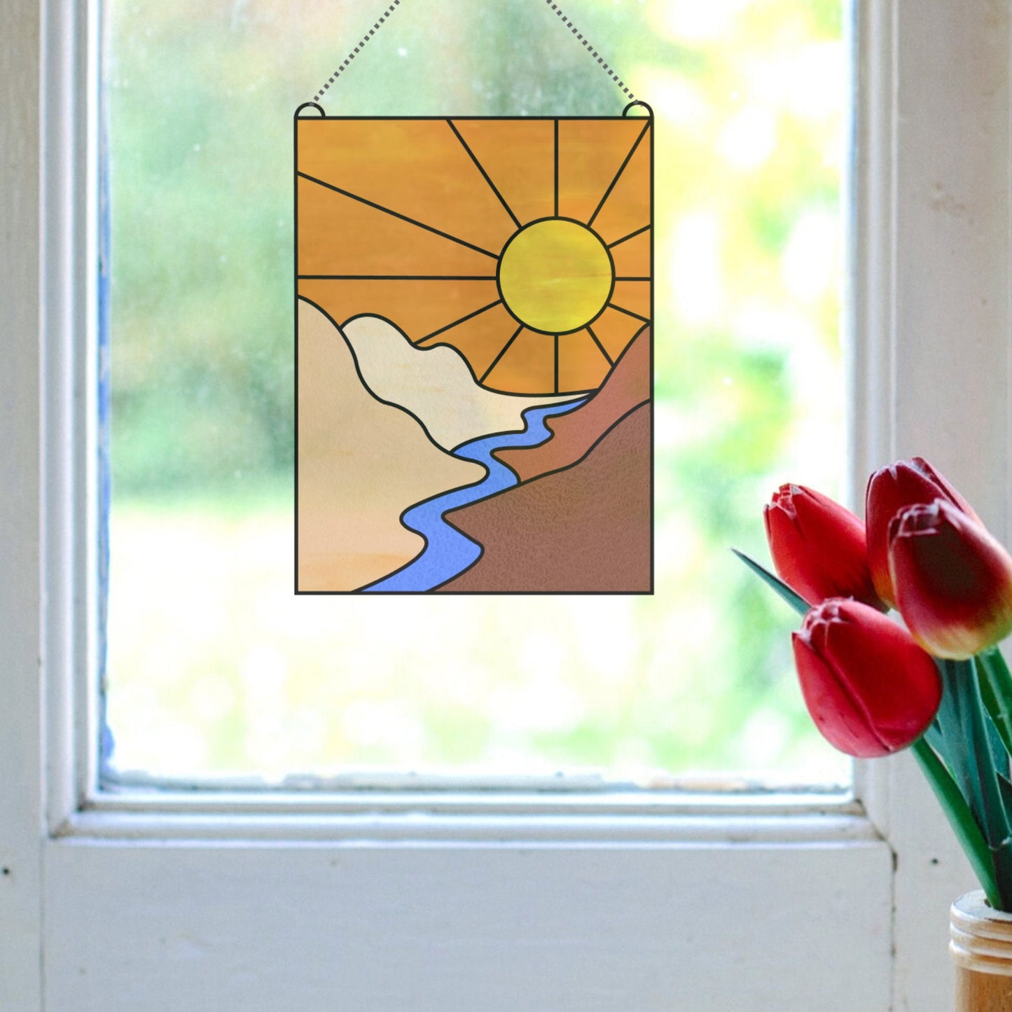 Einfaches Muster zum Aufhängen eines Sonnenfängers bei Sonnenuntergang am Fenster zum Herunterladen
